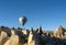 Royal ballons flying in the sunrise light in Cappadocia, Turkey above the Fairy ChimneysÂ rock formationÂ nearby Goreme